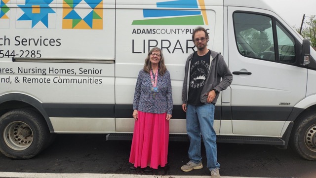 Outreach workers pose infront of Outreach Van.