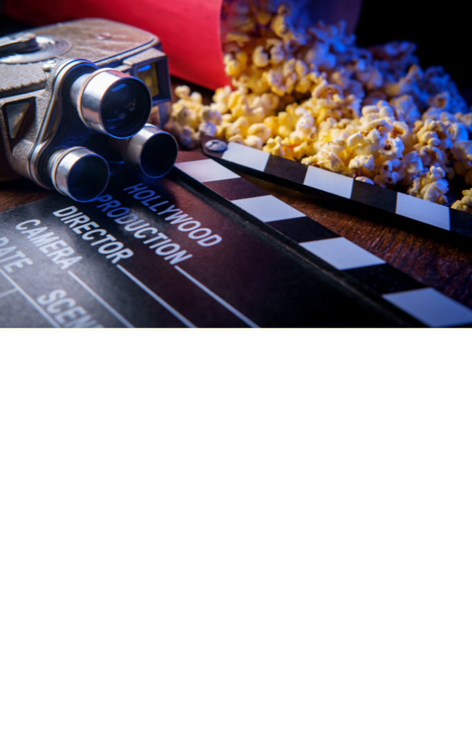 Movie theater popcorn with butter and blue backlighting.
