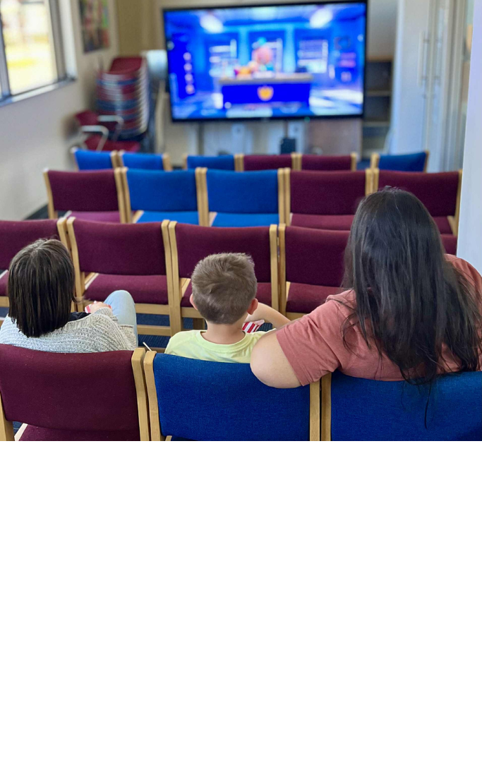 Family watching a movie.