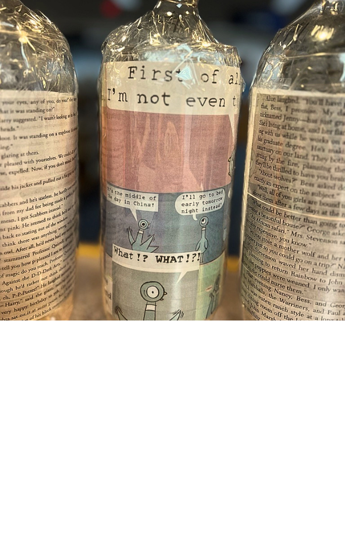 Picture of bottles with pages of books inside. 